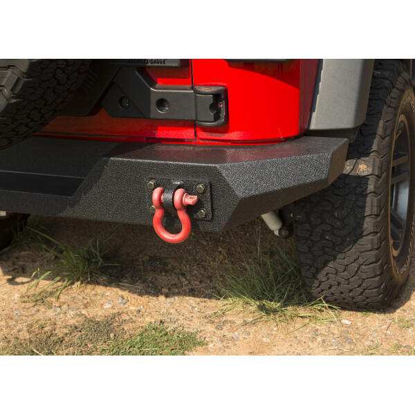 The Rugged Ridge Full Width Rear Bumper is the perfect complement to a Spartan Front Bumper on your Jeep Wrangler JK. This one piece design gives you a rugged off road look without hitting you hard in the wallet. The sturdy steel construction with welded ends will take whatever the outdoors throw at it while the center section features a recess to give you plenty of clearance to fit a larger spare tire if you are running larger tires on your JK. The integrated shackle plates are anchored to the frame giving you a solid recovery point if you every need to be pulled out of a sticky situation. - Image 3
